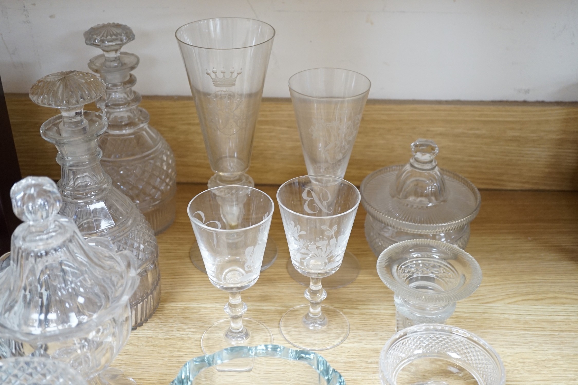 A collection of 19th century hobnail-cut salts, pots, jars and a pair of decanters, etched glasses, etc.